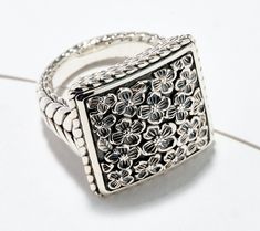 Need something new and exciting to add to your ring collection? Let's get you squared away! This textured, dimensional, and slightly puffed sterling silver ring is a real showstopper with its modern square design. From JAI.