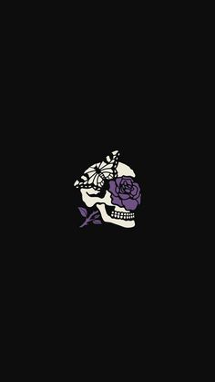 a black background with a skull and purple roses on the bottom half of its face