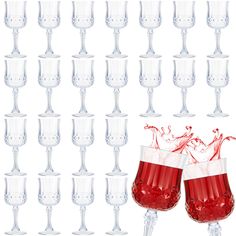 two glasses filled with red liquid are in front of a wall of wine goblets