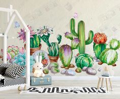 a room with cactus and flowers painted on the wall next to a teddy bear in a toy house