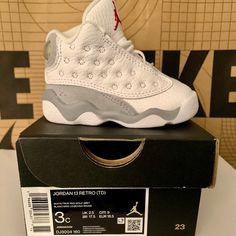 White And Gray Air Jordans 13s Toddler 3c Brand New In Box Baby Jordan Shoes Cool, All Jordans Baby, Jordan Shoes Retro Baby, Cute Air Jordans Baby, Air Jordans Retro 11 Grey, Best Jordans Baby, Black And White Jordans Size 5, Luxury White Jordan Shoes With Boost Midsole, Luxury White Synthetic Jordan Shoes