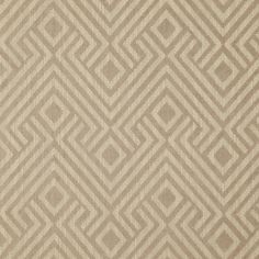 an upholstered beige and white fabric with geometric design on it's surface