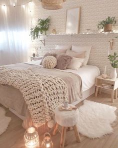 a bedroom decorated in neutral tones and white