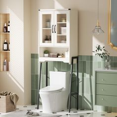 a white toilet sitting in a bathroom next to a green tiled wall and counter top