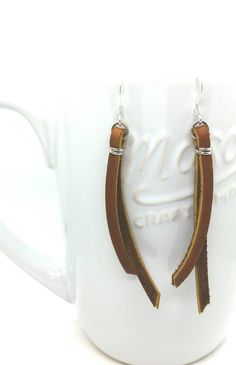 Beautiful dangle latigo leather dangle earrings.  Rich brown leather finished with silver plated and surgical steel plated earring hooks. Prefect for any and every occasion. Available in different leather tones as well as hardware. Minimalist Leather Earrings For Everyday, Modern Brown Leather Earrings, Leather Dangle Earrings With Ear Wire, Minimalist Brown Leather Earrings, Brown Leather Minimalist Earrings, Everyday Leather Dangle Jewelry, Leather Dangle Jewelry For Everyday, Leather Dangle Earrings, Wire Jewelry Ideas