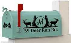 a green mailbox with deer on it and the number 59 deer run rd written in black