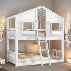 a white bunk bed sitting on top of a carpeted floor next to a christmas tree