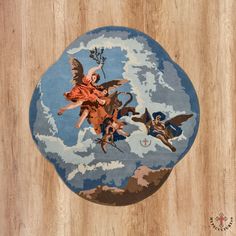 a round rug with angels flying in the sky