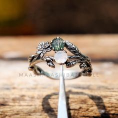 Natural Moonstone & Moss Agate Ring, Silver Branch Ring, Flower Celestial Ring, 925 Sterling Silver Ring, Leaves Dainty Ring, Christmas Gif  》D E T A I L S《 Gemstone: 1). Natural Moss Agate 2). Natural Moonstone Gem Color: 1). Green 2). White Gem Shape: Round Gem Category: Cut Metal: 925 Sterling Silver Purity: 925 Parts Per 1000 Setting Type: Prong Silver Polish: High Ring Size: All Size Available Please note that there Can be slight variations in stone texture and color shades in the actual pr Celestial Ring, Branch Ring, Moss Agate Ring, Christmas Gif, Stone Texture, Dainty Ring, Moss Agate, 925 Sterling Silver Ring, Rings Statement