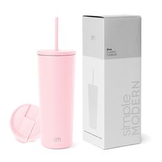 a pink tumbler cup next to a box with a straw in it and the lid open