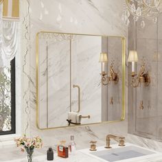 a bathroom with two sinks and a large mirror on the wall above it is decorated in gold