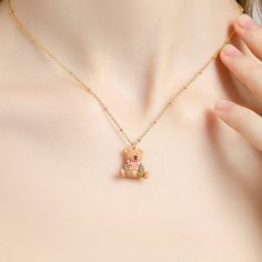 Unlock your inner sweetness with this Candy Bear Necklace, crafted using an enamel finish in a captivating candy color. Its adorable bear design will add a touch of whimsy to any outfit, bringing a classic flair with a hint of the luxurious. DETAILS Plating: 18K Gold Materials: 18K Gold on Brass, Enamel, Cubic Zirconia Size:  Length: 16.33"(41.5cm) + Extender: 1.77"(4.5cm) Weight:  12.3g Sweet Valentine's Day Necklace As Gift, Gummy Bear Necklace, Cat Pendant Necklace, Unique Gift Wrapping, Blue Candy, Horses Pendant, Bear Necklace, Bear Pendant, Cat Pendants