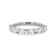 a white gold wedding band with five round diamonds