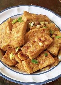 tofu with onions and scallions in a bowl