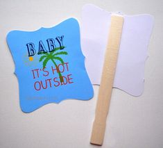 a wooden toothbrush next to a cutout of a baby it's not outside sign