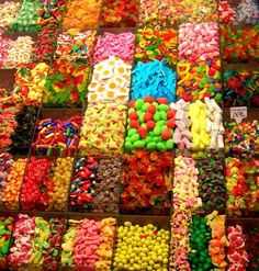 many different colored candies are on display