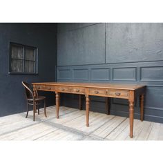 A large French library table from the early 20th century. Solidly made in oak. Also ideal as a dining table for 6-8 persons.  Table frame standing on a rectangular ground plan with 8 turned legs, frame and profiled top protruding slightly all around. 6 drawers with cast iron handles.  Dimensions:  78 cm high / 30.7 inch high, 256 cm wide / 100.78 inch wide, 100 cm deep / 39.37 inch deep.  Height from floor to frame: 62 cm / 24.4 inch.  If necessary, the table can be disassembled into 3 parts for 8 Person Dining Table, French Library, Dining Table Plans, Oak Library, Ground Plan, French Farmhouse Table, Convertible Table, Cast Iron Handles, Long Dining Table