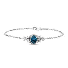 Add this mesmerizing Cinderella bracelet to your wardrobe and be inspired to find the magic in your life. This sterling silver creation features an oval London Blue Topaz framed by diamonds and flanked by sculpted bloom and foliage. Let this bracelet aid you in radiating Cinderella's positivity and perseverance and man Cinderella Bracelet, Cinderella Engagement Rings, Enchanted Disney, Disney Bracelet, Enchanted Disney Fine Jewelry, Disney Fine Jewelry, Romantic Jewellery, Jewelry Sterling Silver, Shop Engagement Rings