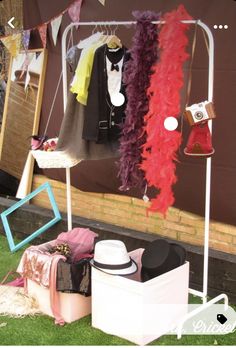 an assortment of clothing and hats on display