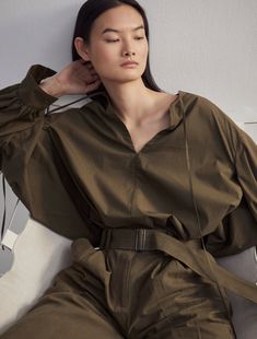 This mini dress is designed with an oversized silhouette adding volume to the A-line shape. Crafted from premium organic cotton woven in Turkey, the long sleeve shirt-dress features a slit neckline with drawcords and large, cuffed sleeves. Wear on its own for more impact or tucked into high-waisted trousers for an edgy look.

 

Resort 2024 is a capsule of elevated, everyday staples and evening pieces designed with an unmistakable air of effortless sexiness.

 

Each purchase you make helps us g Effortless Workwear, Large Belt, Resort 2024, Edgy Look, Oversized Silhouette, Long Sleeve Shirt Dress, High Waisted Trousers, Cuff Sleeves, Off Duty