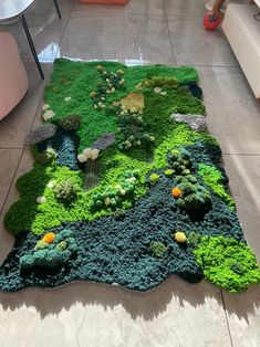 a rug made out of grass and rocks on the floor