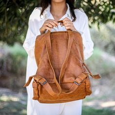 This stunning backpack is made of genuine soft nappa leather in a Honey Brown color. With enough room for all your daily essentials, It is perfect for everyday use, as well as for laptops of all sizes, IPAD, A4 files, books and travel. it as a unique structured with a zipper closure at the top, and three outside zipper pockets for mobile, keys, etc. It is fully lined with black strong cotton fabric which I divide to two large interior, zip pocket, and a leather cell phone pocket, shoulder strap Rectangular Faux Leather Backpack For Daily Use, Large Capacity Faux Leather Backpack, Faux Leather Travel Satchel Backpack, Faux Leather Satchel Backpack For Travel, Faux Leather Satchel Backpack, Leather Softback Shoulder Bag For Everyday Use, Leather Softback Shoulder Bag, Casual Faux Leather Standard Backpack, Leather Backpack With Large Capacity