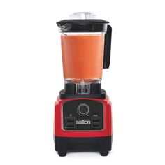 a red blender filled with liquid on top of a white background