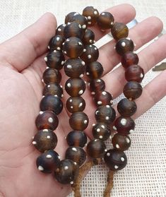 Vintage African trade beads skunk, Venetian glass beads Necklace Strand Vintage African trade beads skunk, Venetian glass beads Necklace Strand * BEADS: 39 PCS * Color : Brown  * Full Strand     INFORMATION                        SHIPPING,PAYMENT,                        RETURN,FEEDBACK 1:We Freely Ship all our items to all over the world via USPS OR Airmail Register Thailand with providing tracking numbers 2:we ship worldwide within 2 business days after receiving clear payments Brown Glass Beads For Jewelry Making, Handmade Brown Glass Beads, Handmade Round Glass Beads, Handmade Spiritual Glass Beads, Unique Brown Polished Beads, Spiritual Handmade Glass Beads, Traditional Glass Beaded Necklaces With Oval Beads, Vintage Hand-strung Beaded Necklace With Round Beads, Glass Bead Necklaces 8mm