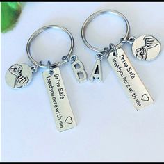 three key chains with two different charms on them