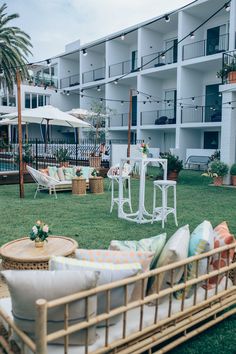 an outdoor seating area with tables and chairs