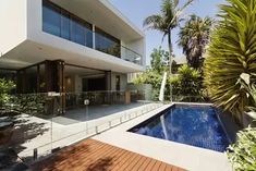 a modern house with a swimming pool in the foreground