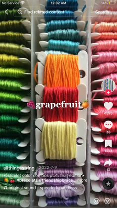 several spools of colorful thread are on display in a store window with the caption grapefruit