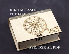 a laser engraved wooden box with the word tarot printed on it