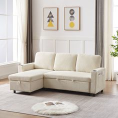 a living room with a white couch and rug