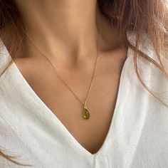 Raw Peridot Necklace! A Peridot drop pendant to offer as a Jewelry gift or birthday gift. Did you know? Peridot is August's birthstone. So, this minimalist necklace is a great idea for  Virgo gifts or  Leo gifts. ✔️Genuine  Peridot Necklace✔️ You will love this bright green color of nature. High-Quality 925 Sterling Silver * Finish 24K Gold  This Peridot Drop necklace is great for wearing alone or for layering with other necklaces.   Handmade in Greece.   You can get it within 2-5 business with EXPRESS shipping. Just upgrade at checkout Moreover, Peridot is a really powerful crystal you will love to wear.   >>Chain SIZE Available options in length of     16,  18,   20 inches (  40,  45, 50 cm)   >>IS IT A GIFT? This peridot necklace comes in a beautiful artiby gift box. If you wish to send Leo Gifts, Virgo Gifts, Raw Peridot, Necklaces Handmade, Peridot Necklace, Power Crystals, Gifts Jewelry, Teardrop Necklace, August Birth Stone