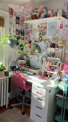 a room with lots of clutter on the walls and desks in front of it