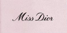 the word miss dior written in cursive black ink on a pink background