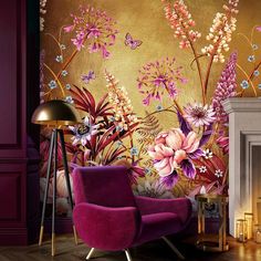 a purple chair in front of a wall with flowers on it and a gold background