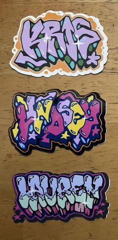 three stickers with different designs on them