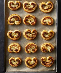 baked pastries on a baking sheet ready to go into the oven for making heart shaped pretzels