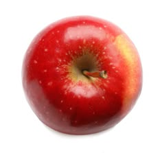 an apple that is red and yellow with some brown spots on the inside of it