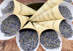 four white bowls filled with lavender sprinkles