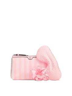 a pink purse with a bow and matching hat