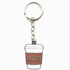 a coffee cup shaped keychain with the word coffee on it's side