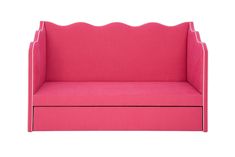 a pink couch with scalloped edges and a white back drop in the middle