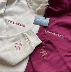 three sweatshirts with embroidered name tags on them