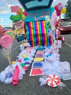 an assortment of candy land items on the ground