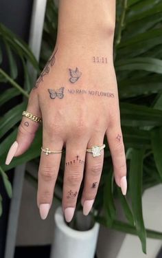 a woman's hand with tattoos on it and the words no rain, no flowers