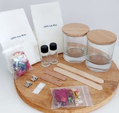 an assortment of items are displayed on a wooden tray