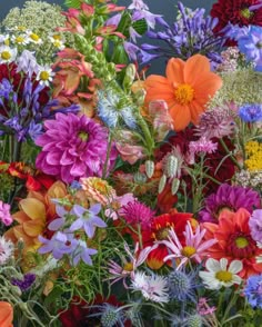 a bunch of flowers that are in some kind of vase